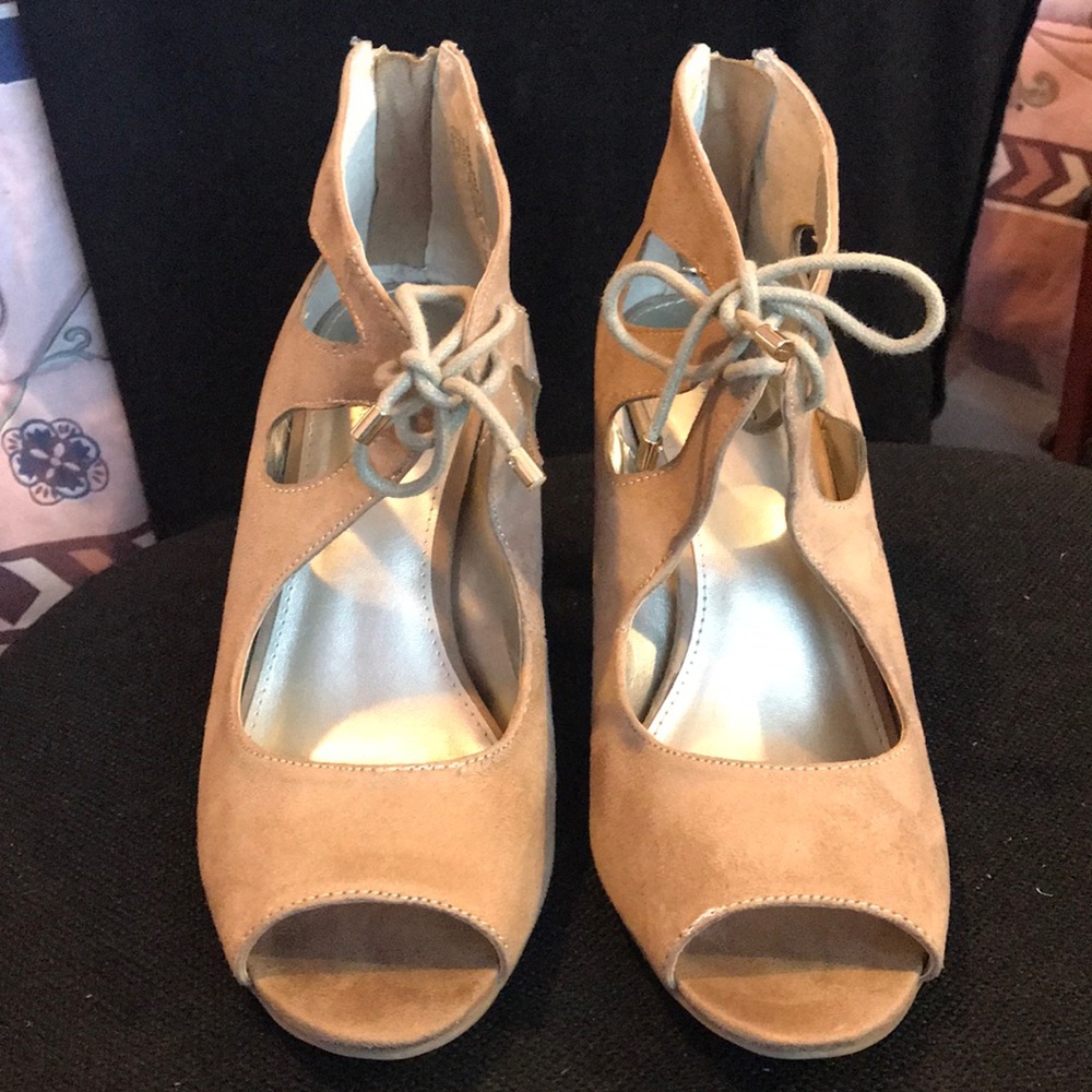 Peep toe tan suede heels.